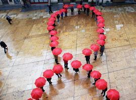 NNGG de Oviedo conmemora el #Día del #Sida con un colorido lazo humano 